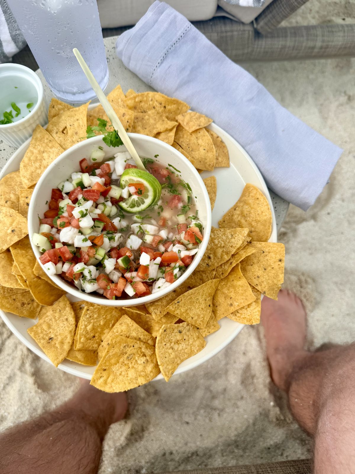 Tortilla chips and pico de gallo on the beach
