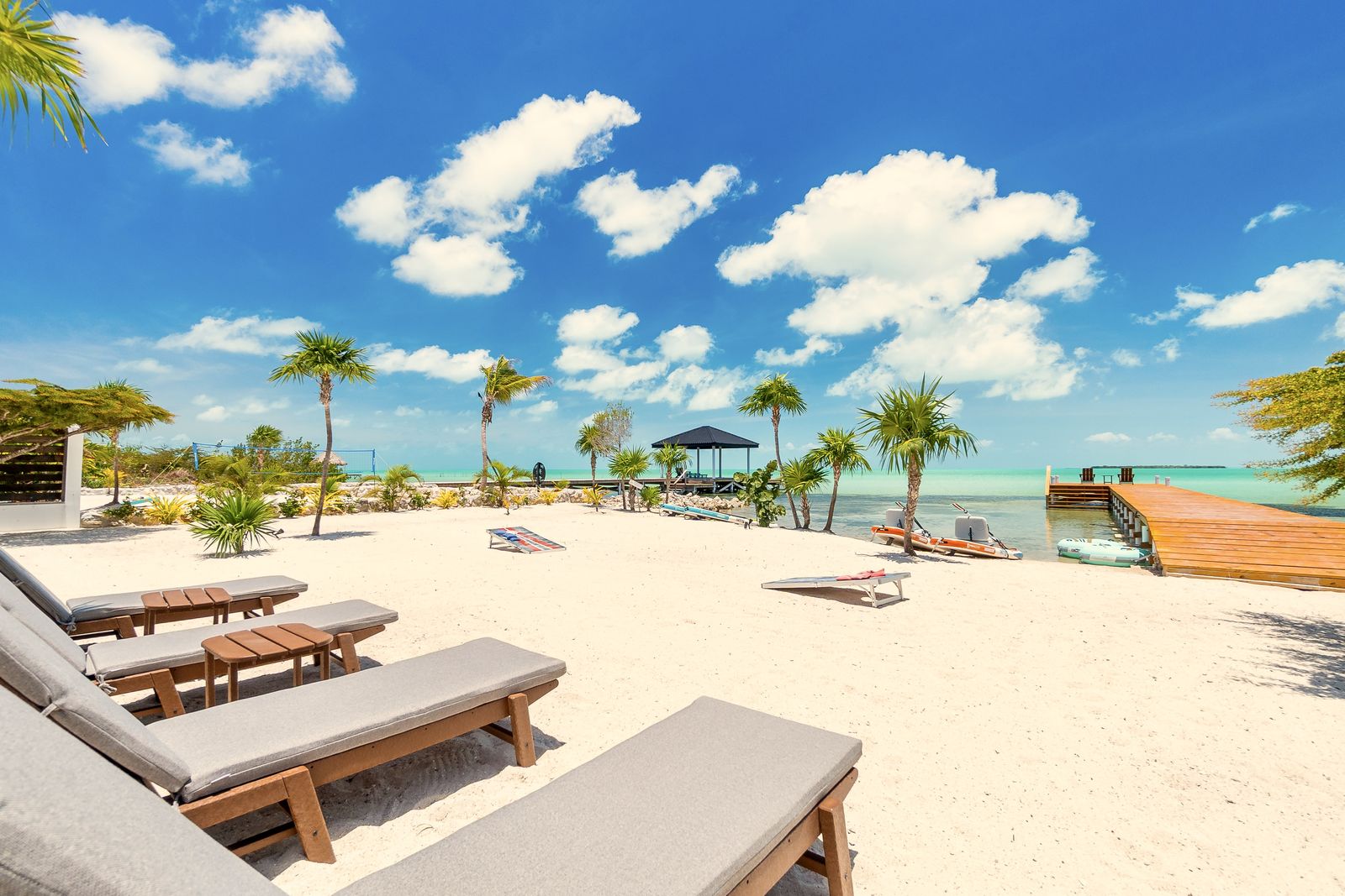 Paddleboards and kayaks beside the private dock, included with the villa