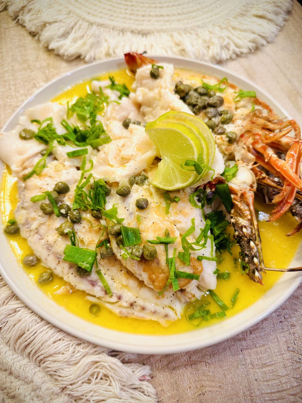Fresh fish and shrimp in a lime and caper butter sauce