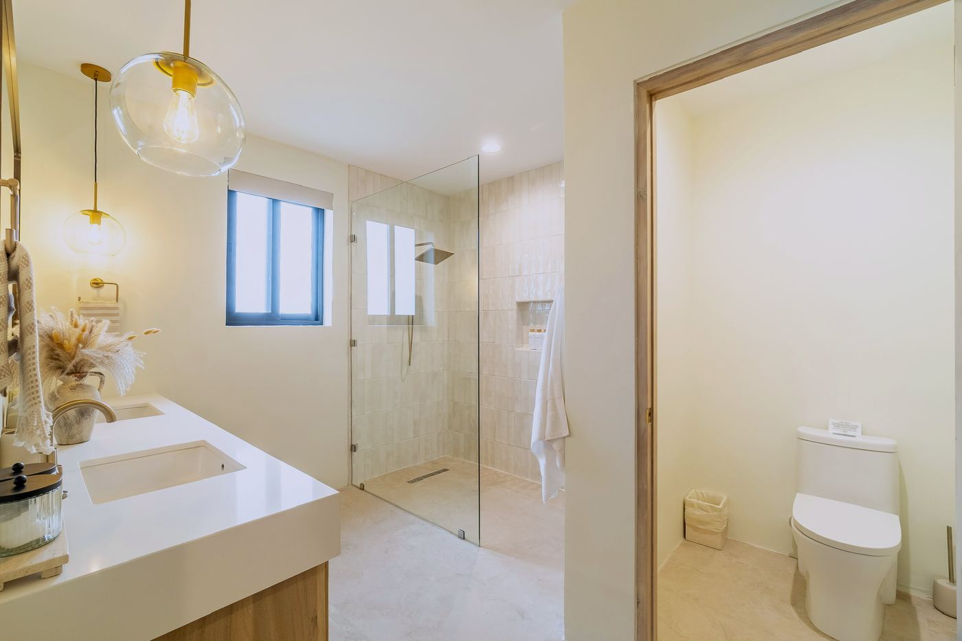 An en-suite bathroom with a walk-in shower and double vanity