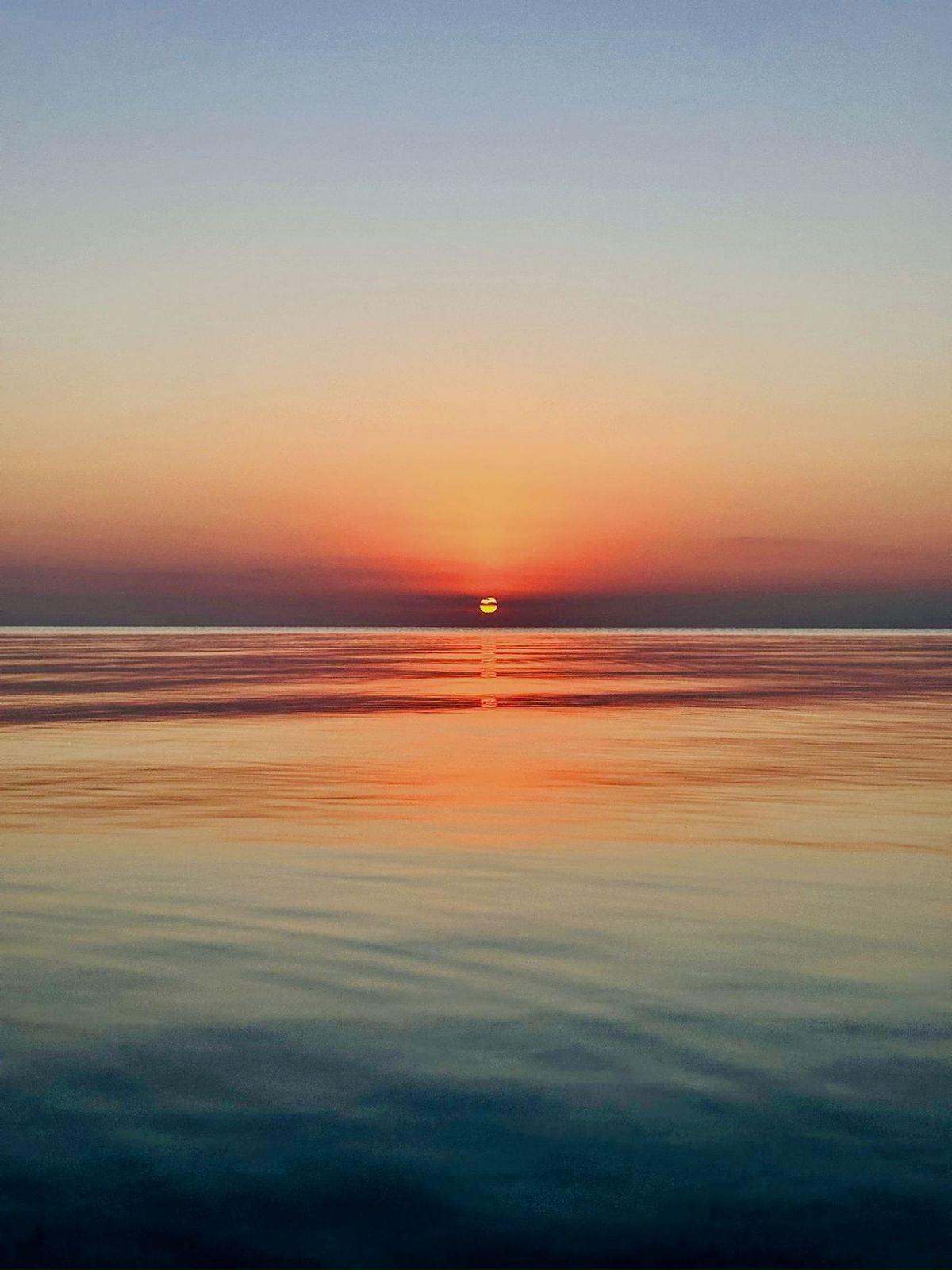 West-facing sunset over the water from the villa