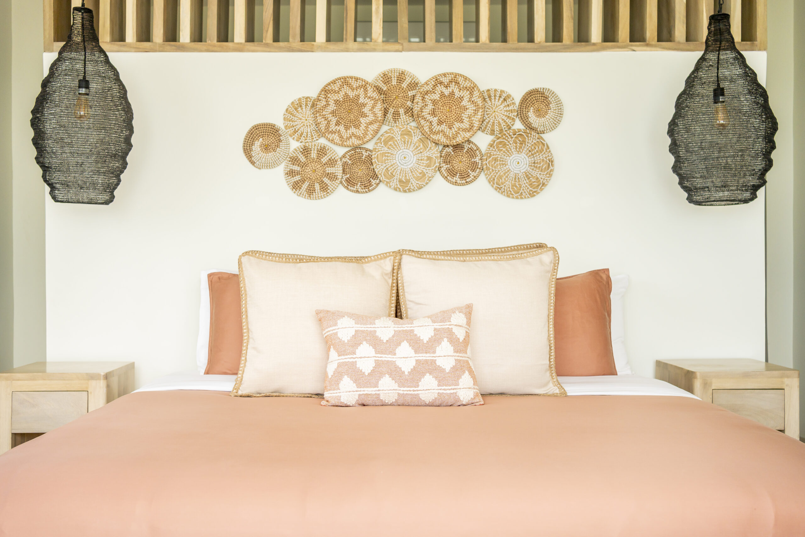 Luxury king bedroom with en-suite bathroom, oceanfront balcony, and modern tropical decor at Black Orchid Oasis in San Pedro, Belize.